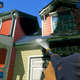 A screenshot of grime being blasted off a lovely house in FuturLab's PowerWash Simulator.